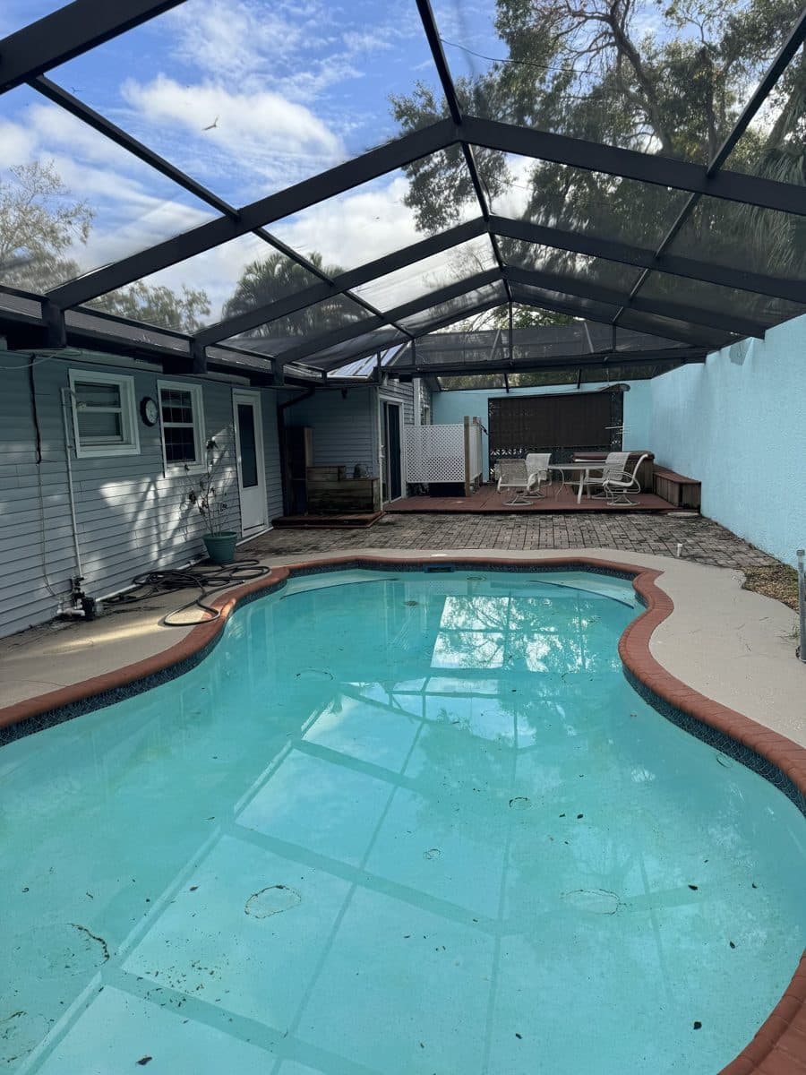 Screened private pool under the Florida sky